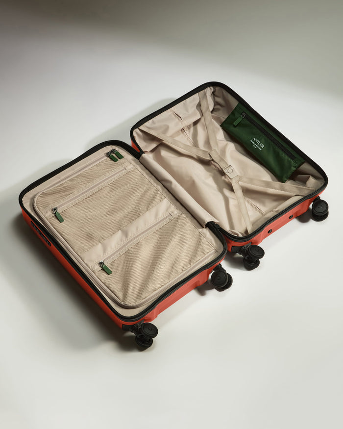 a suitcase with wheels and open lid