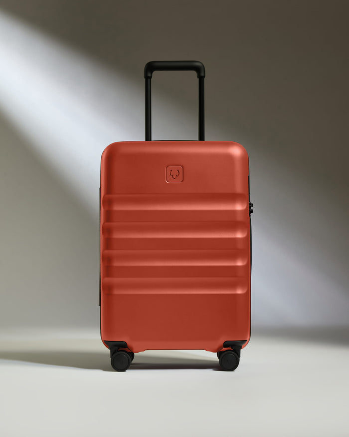 a red suitcase with wheels
