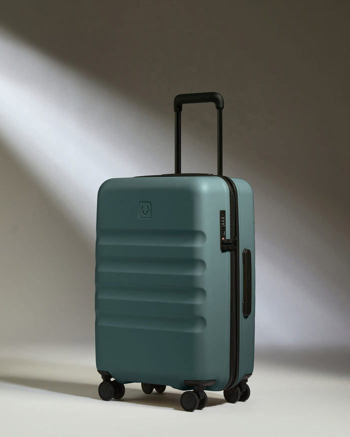 a blue suitcase with wheels