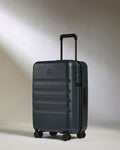 a suitcase on wheels with a light shining on it
