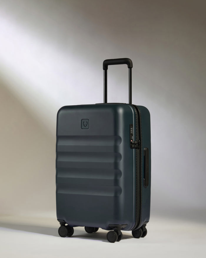 a suitcase on wheels with a light shining on it