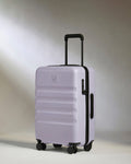 a purple suitcase with wheels