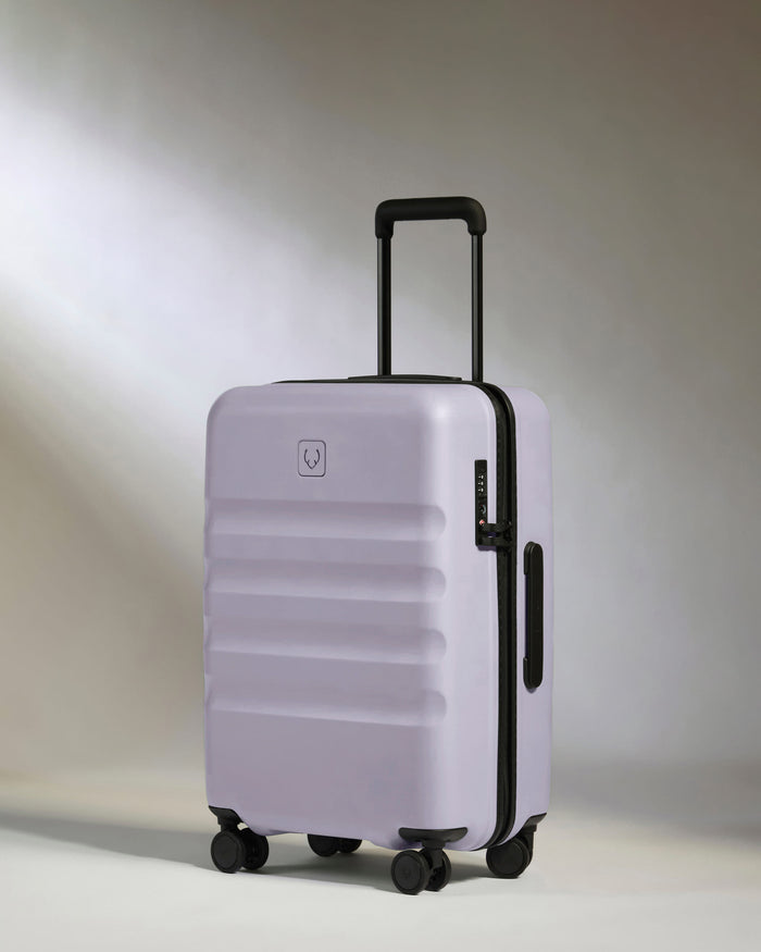 a purple suitcase with wheels