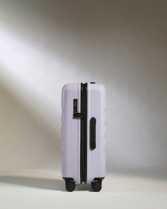 a purple suitcase with wheels