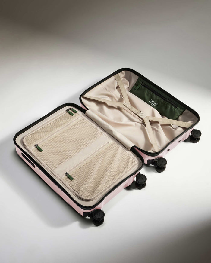 a pink suitcase with wheels