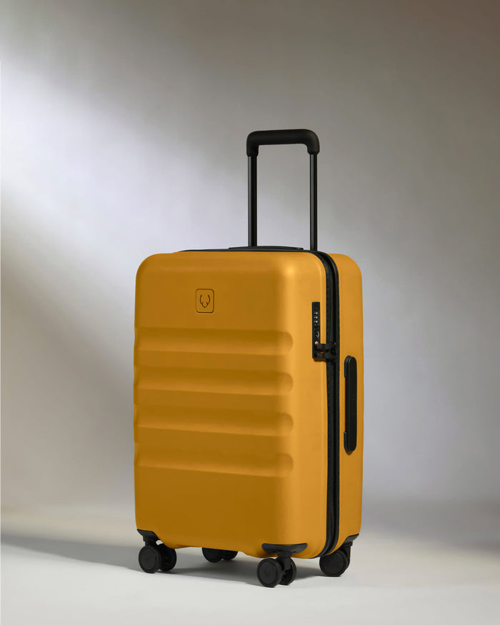 a yellow suitcase with wheels