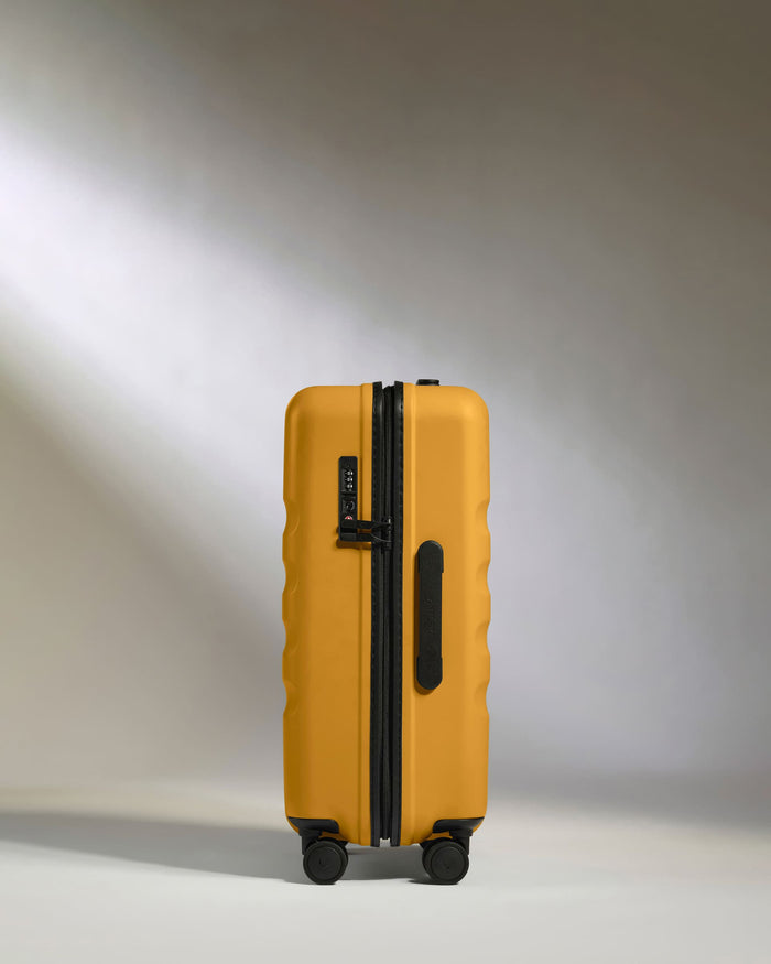 a yellow suitcase with wheels