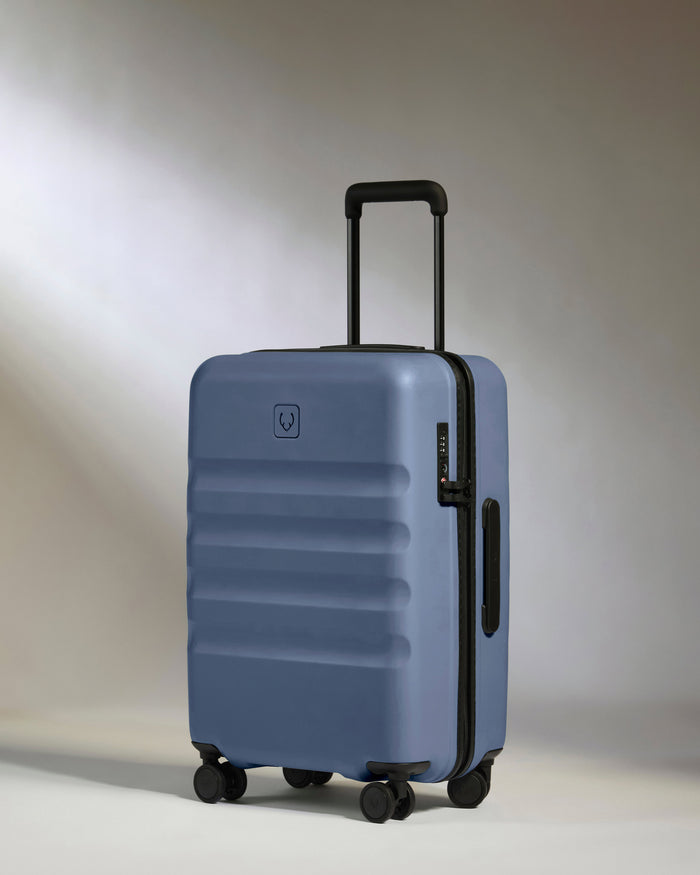 a blue suitcase with wheels