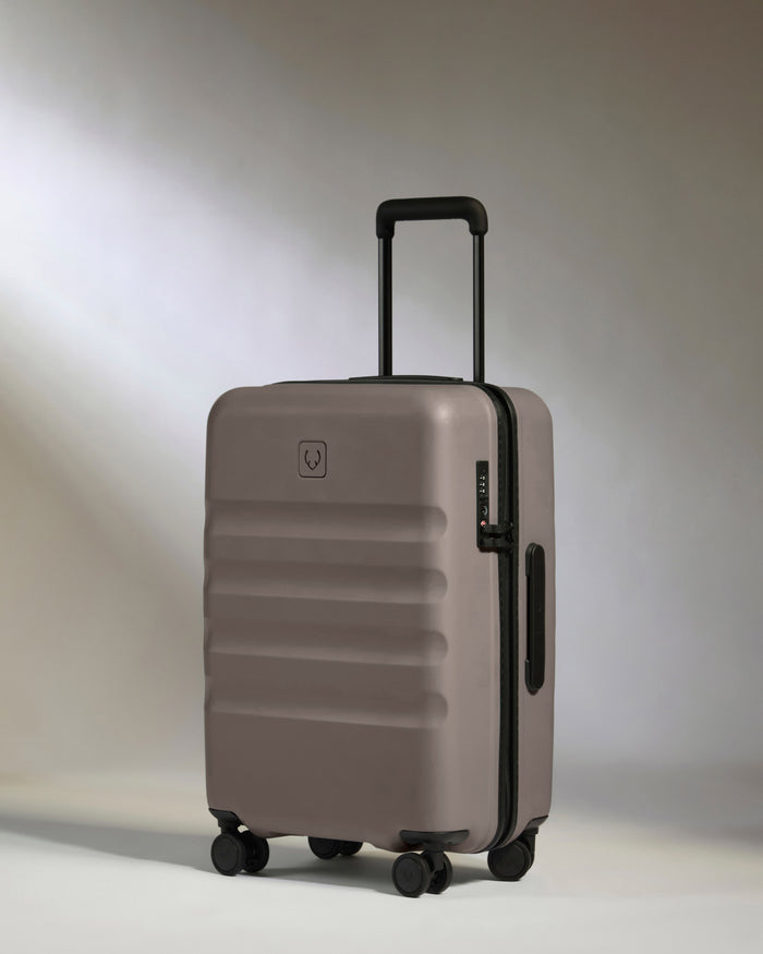 a grey suitcase with wheels