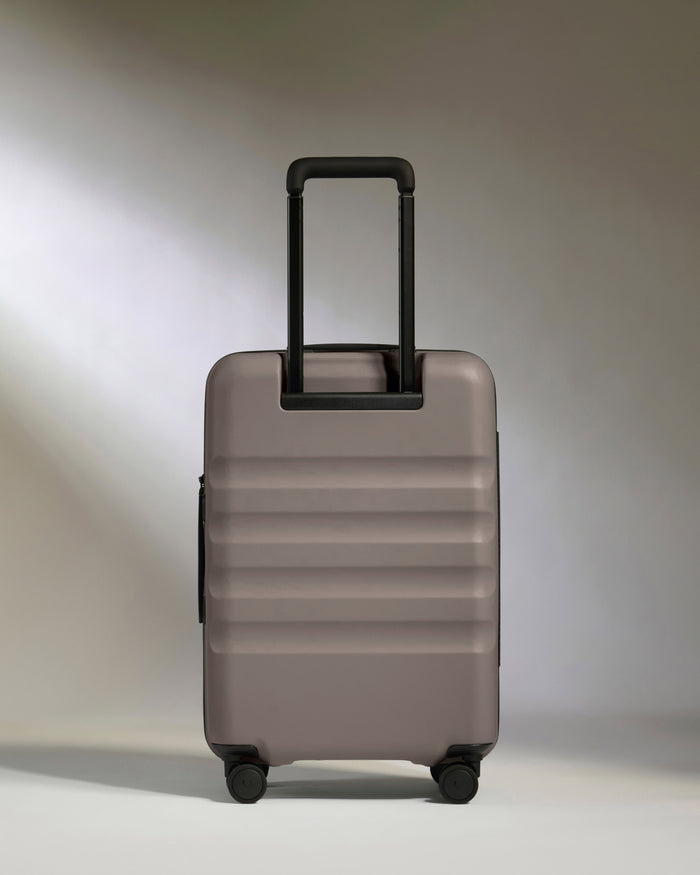 a grey suitcase with black handle