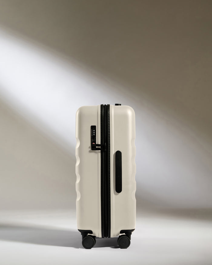 a white suitcase with wheels