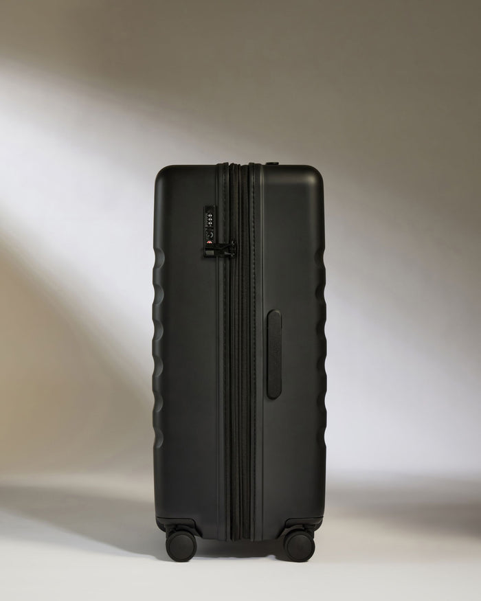 a black suitcase with wheels