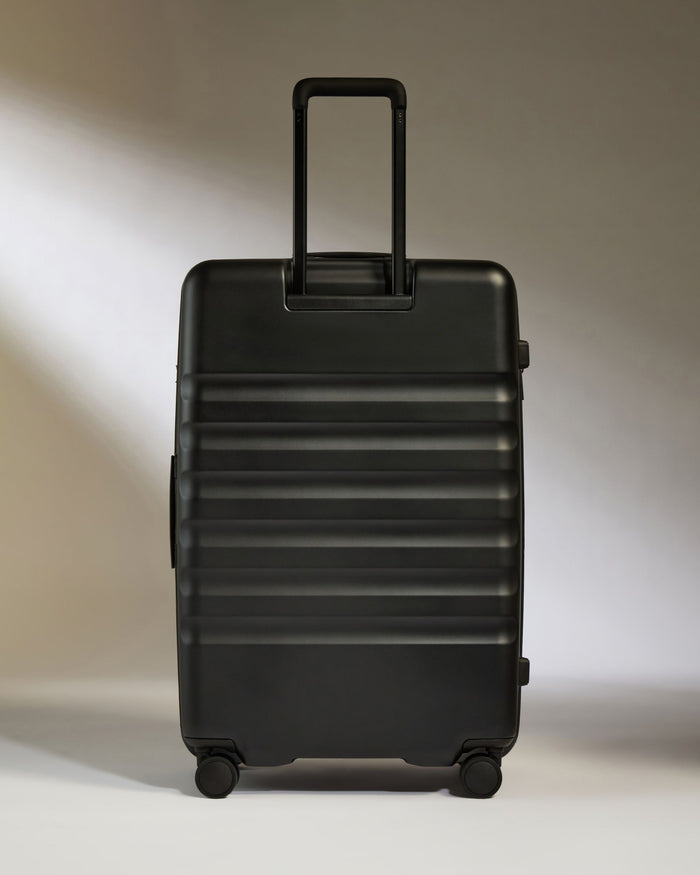 a black suitcase with wheels
