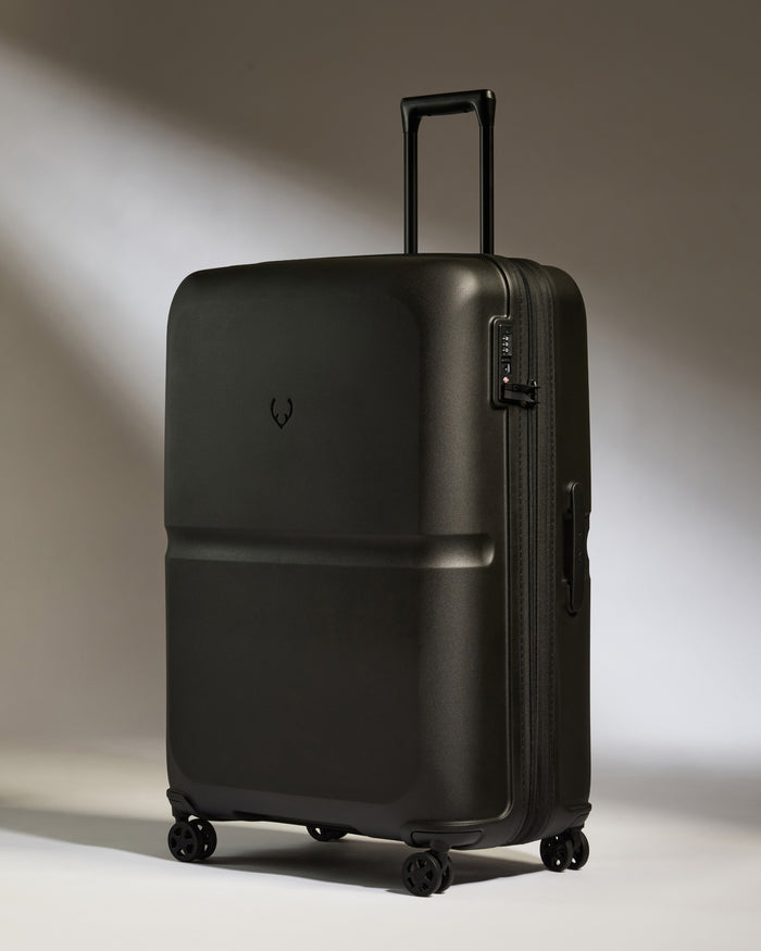 a black suitcase with wheels