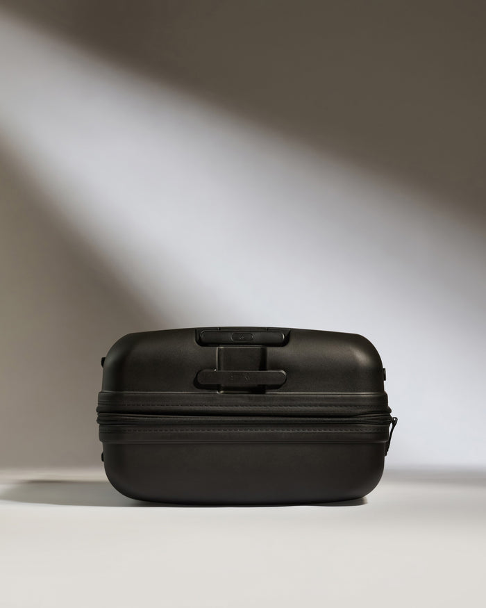a black suitcase with a zipper