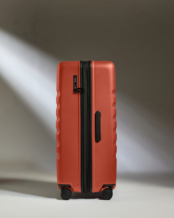 a suitcase with wheels and light shining on it