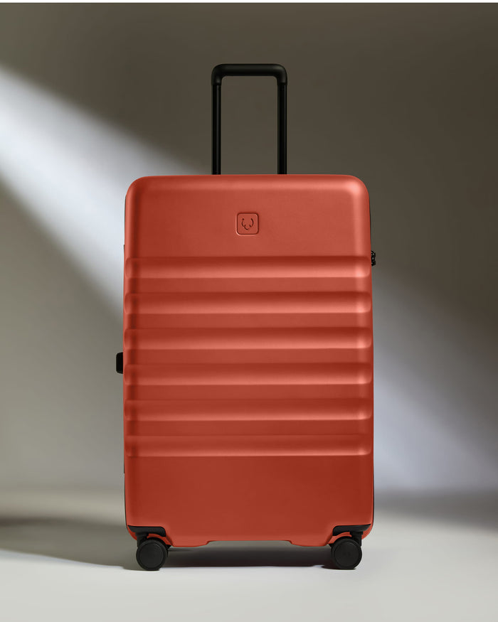a red suitcase with wheels