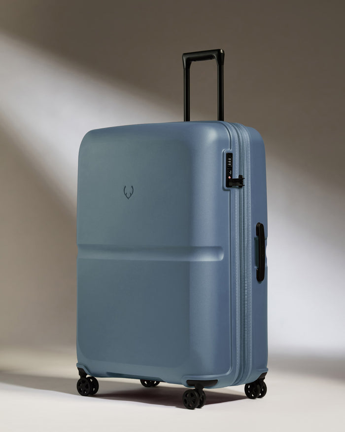 a blue suitcase with wheels