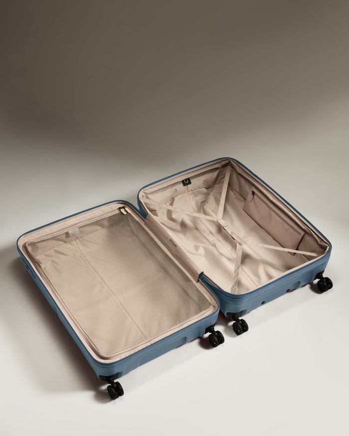 a suitcase with wheels and a lid