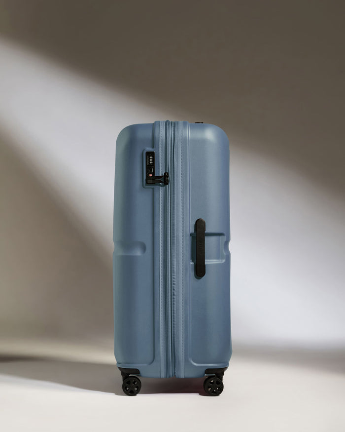 a blue suitcase with wheels