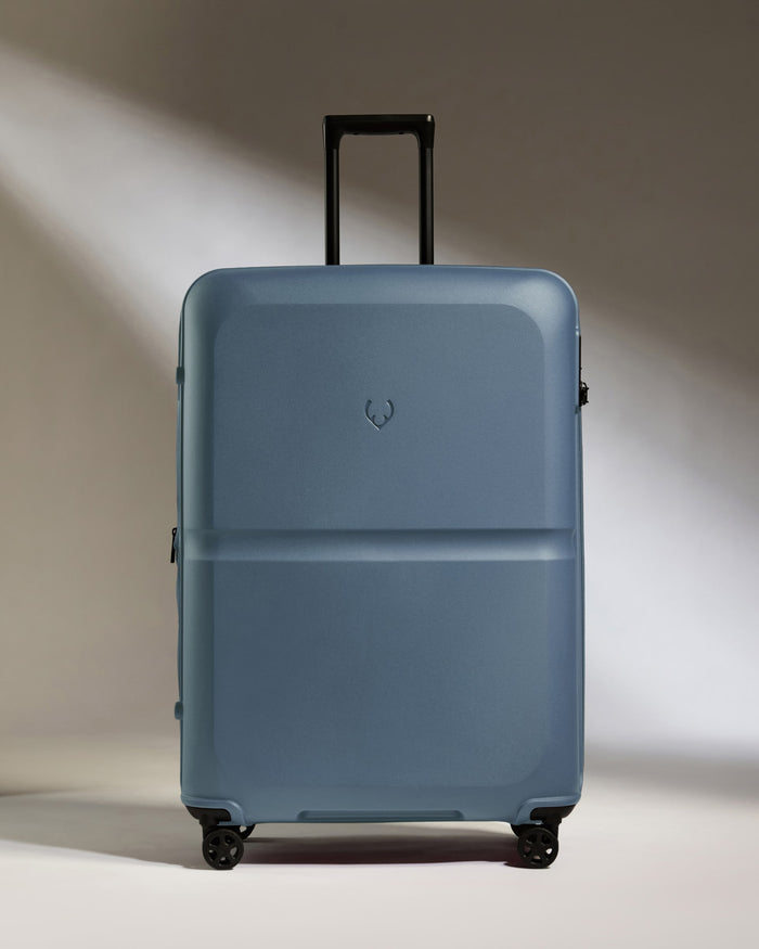 a blue suitcase with wheels