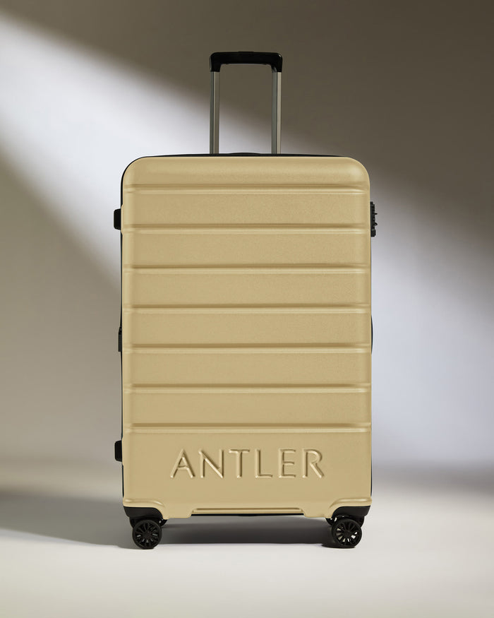 a tan suitcase with handle