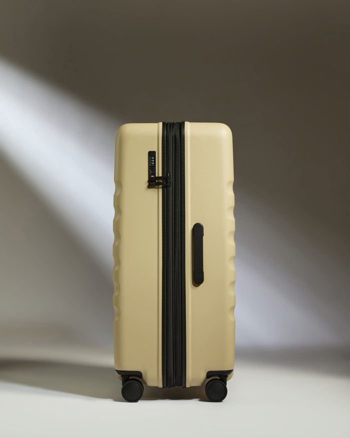 a suitcase with wheels and a light shining on it