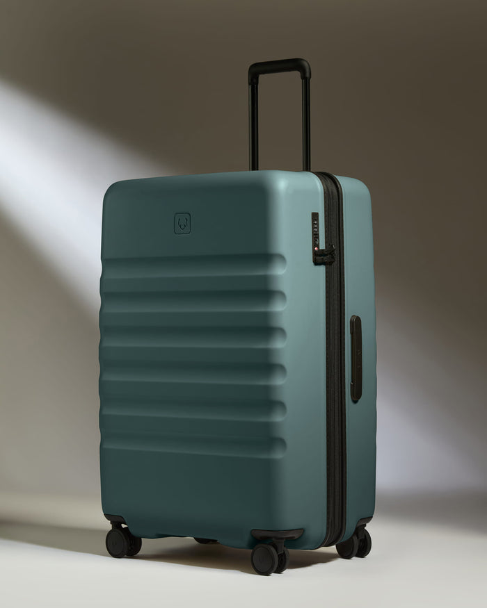 a blue suitcase with wheels