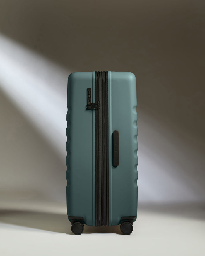 a suitcase with wheels and light shining through it