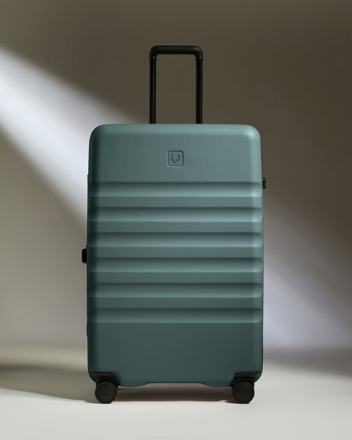 a blue suitcase with wheels