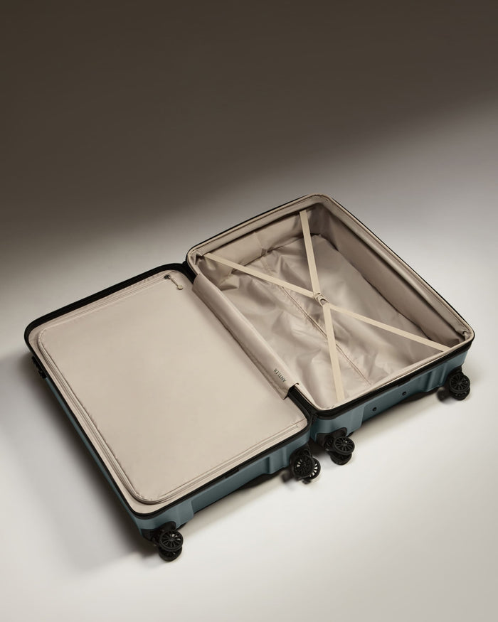 a suitcase with wheels and a lid
