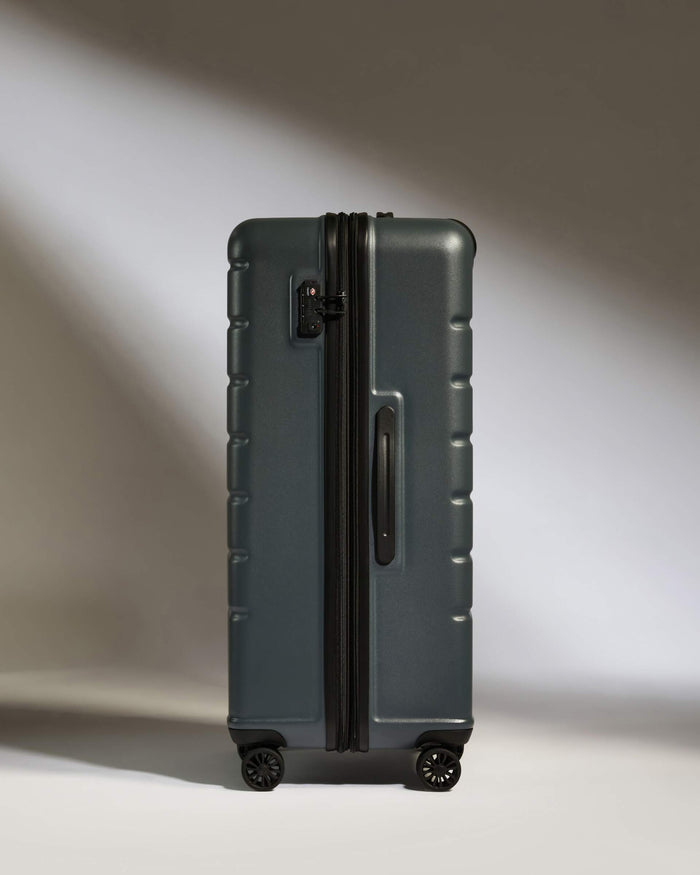 a suitcase on wheels with a light shining on it