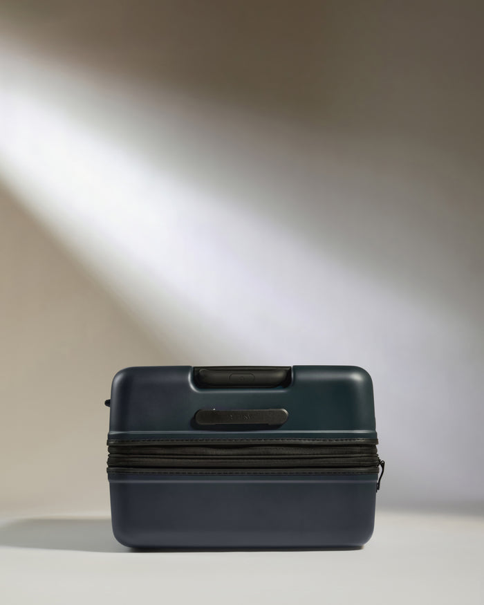a blue suitcase with a zipper