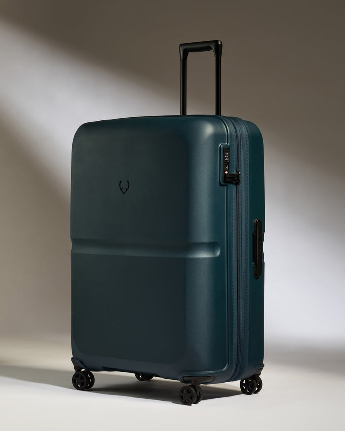 a blue suitcase with wheels