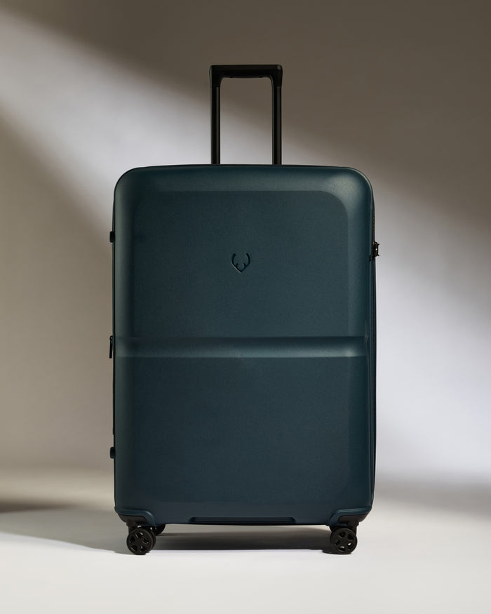 a blue suitcase with wheels
