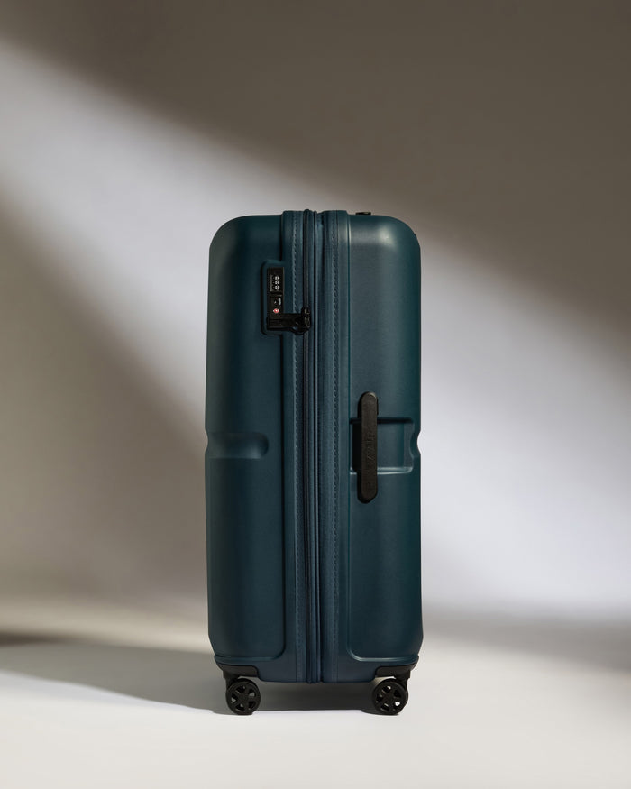 a blue suitcase with wheels