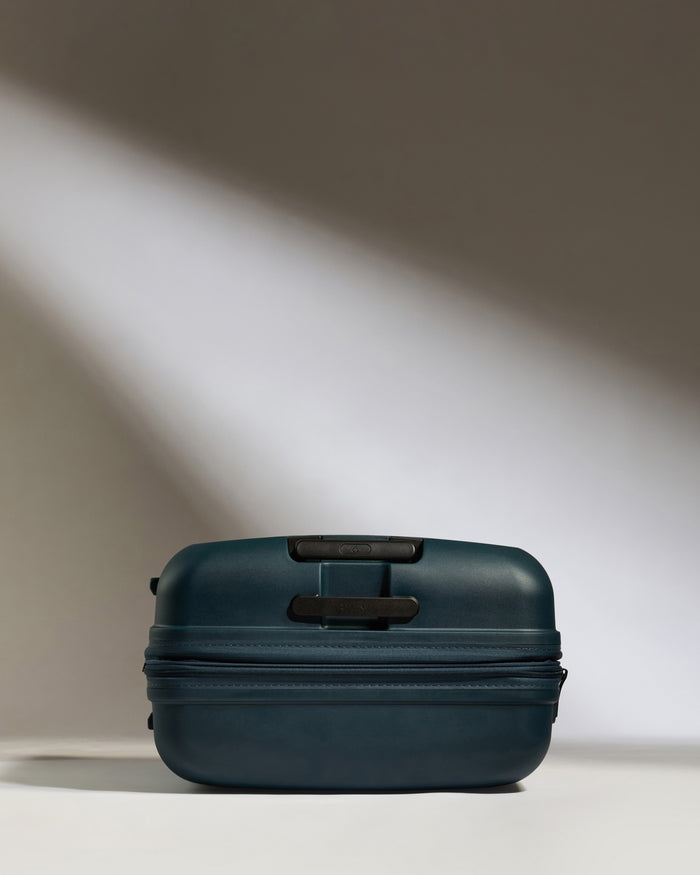 a blue suitcase with a zipper