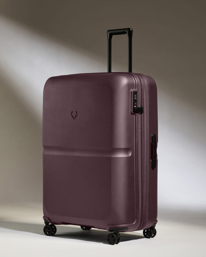 a purple suitcase with wheels