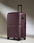 a purple suitcase with wheels