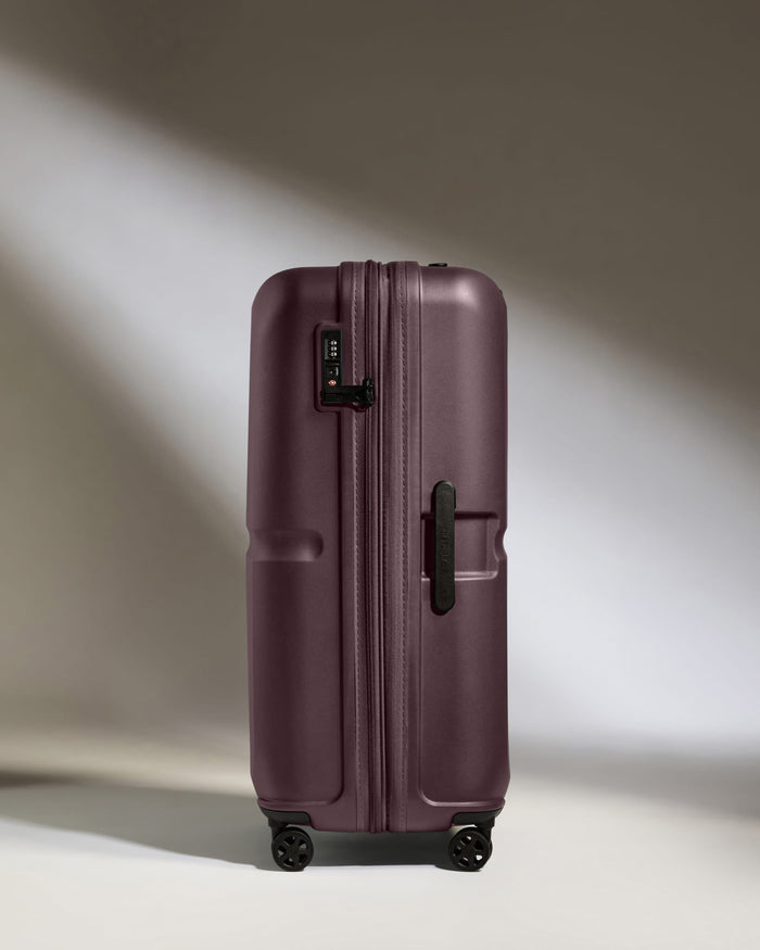 a purple suitcase with wheels