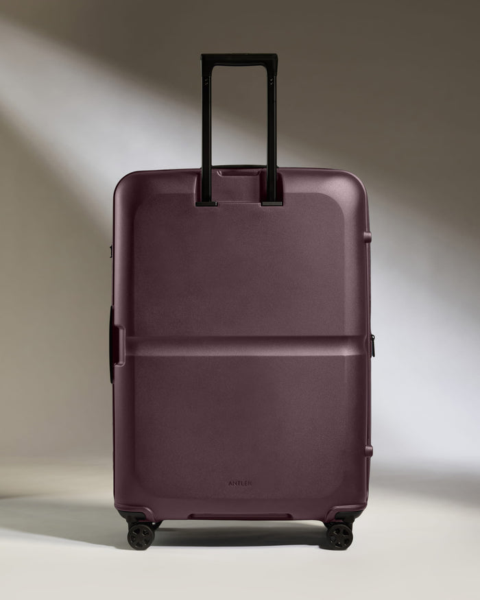 a purple suitcase with wheels