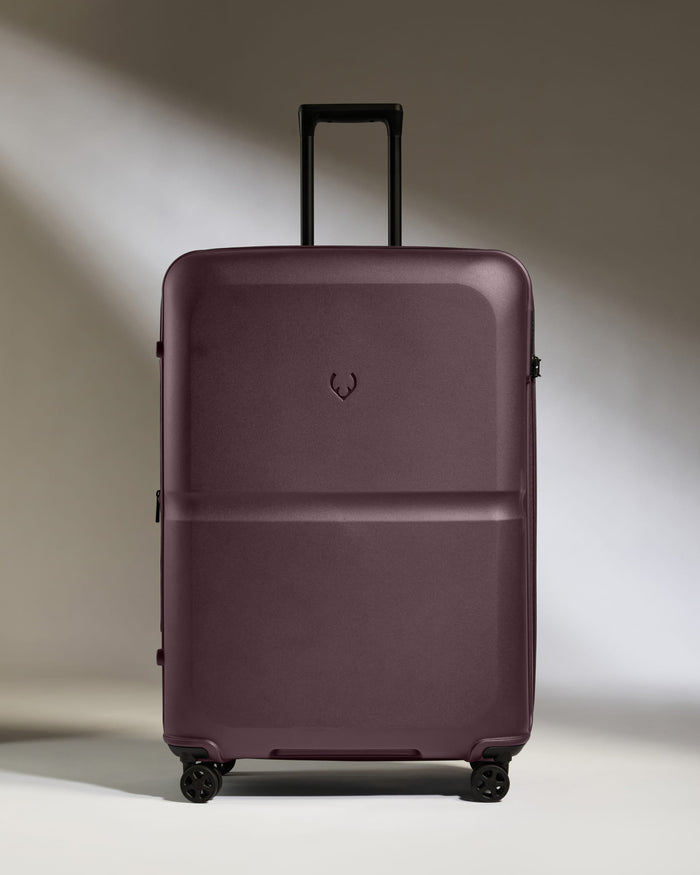 a purple suitcase with wheels