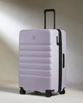 a purple suitcase with wheels