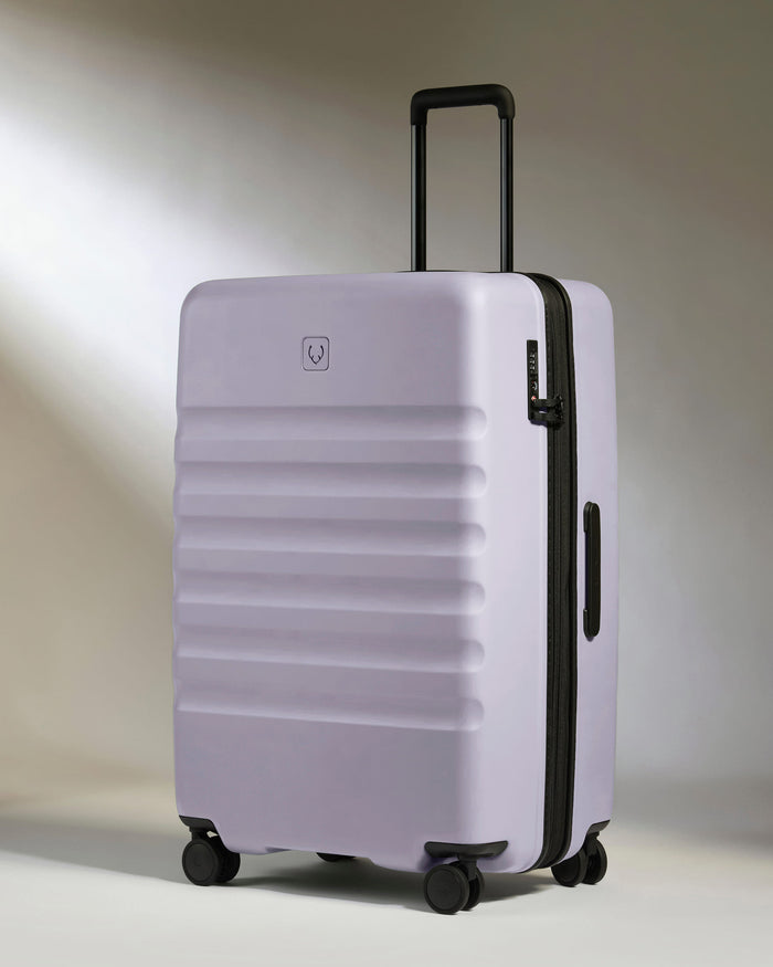 a purple suitcase with wheels