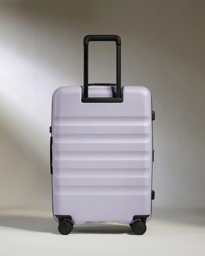 a purple suitcase with wheels