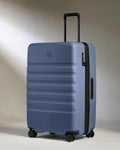a blue suitcase with wheels