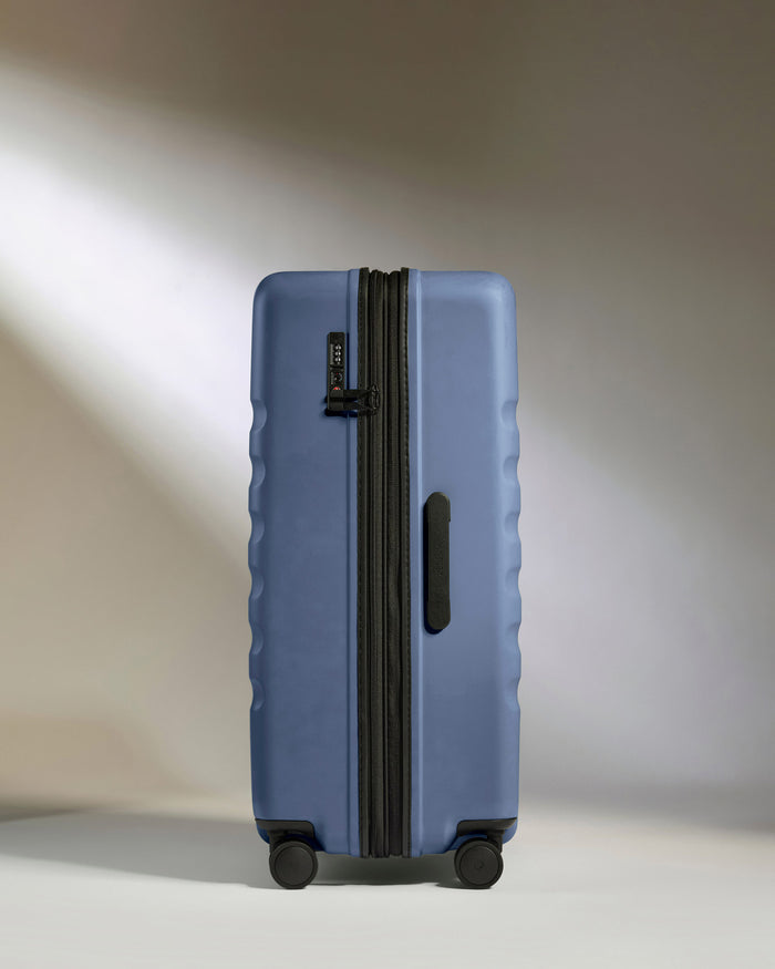 a blue suitcase with wheels