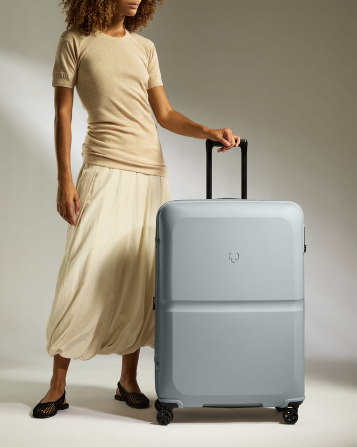 a woman holding a suitcase