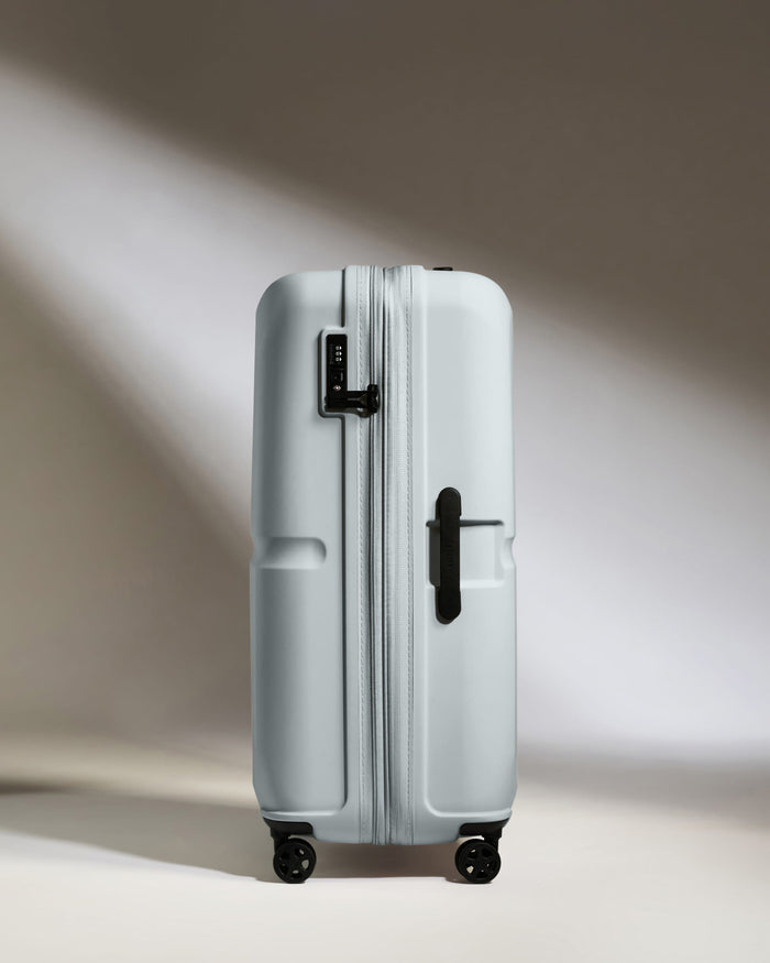 a white suitcase with wheels