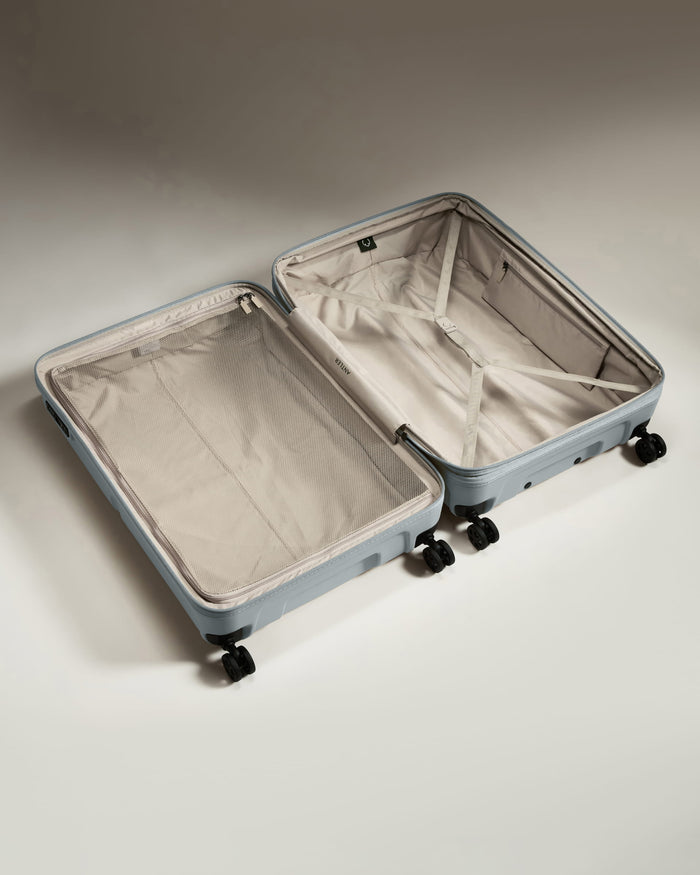 a suitcase with wheels and a lid